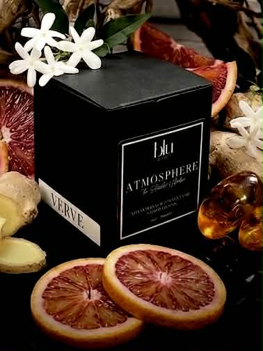 Black box labeled 'blu Atmosphere' with flowers and fruit on a dark background