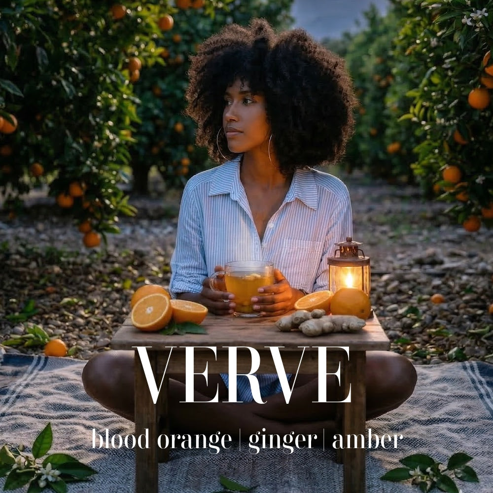 Woman in an orange grove at dusk with ginger tea representing Verve luxury artisan candle.