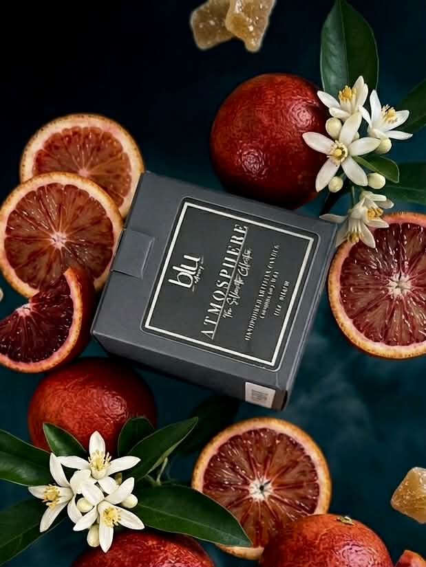 Verve artisan Candle box for Atmosphere by BLU with blood oranges and flowers on a dark background