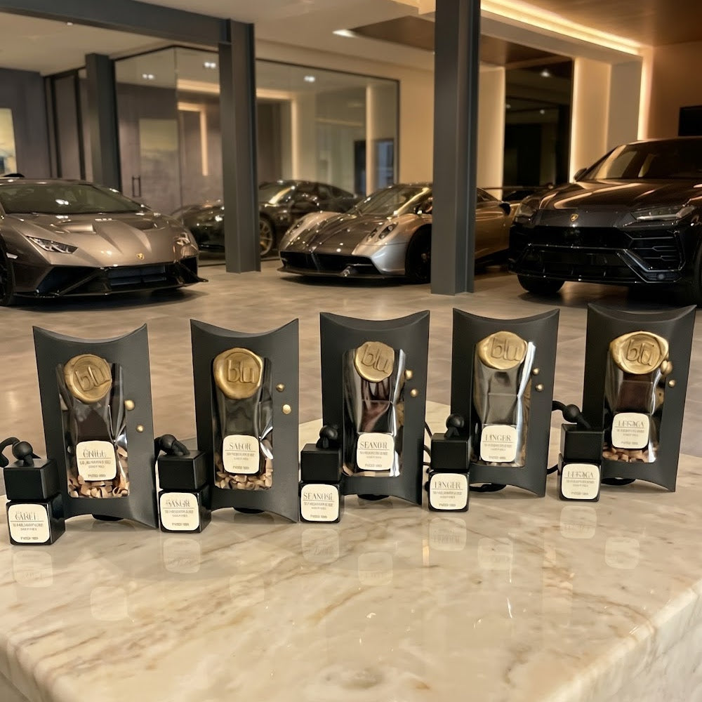 LEGACY leather tobacco car diffuser collection displayed in luxury automotive showroom