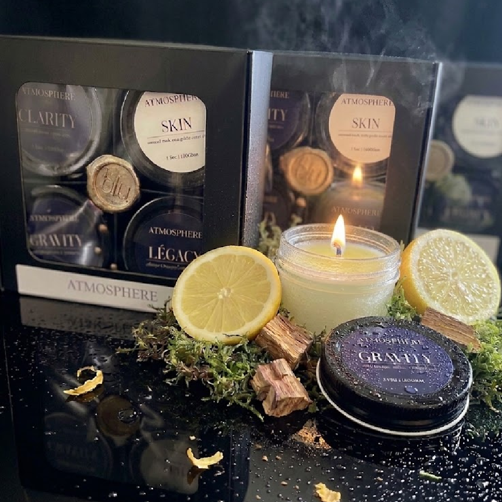 Gravity artisan candle from The Icons Discovery Set styled with fresh lemon and palo santo