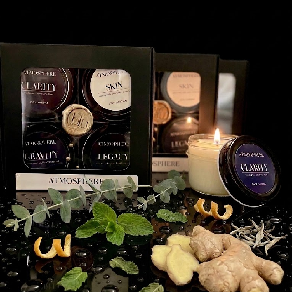 Clarity artisan candle from The Icons Discovery Set styled with fresh ginger, eucalyptus, and mint