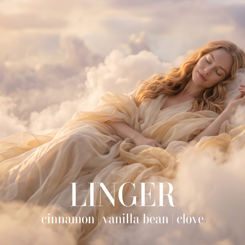 A woman resting peacefully in a golden-hour dreamscape of voluminous clouds, illustrating the comforting and relaxing "Linger" fragrance by BLU with cinnamon, vanilla bean, and clove.
